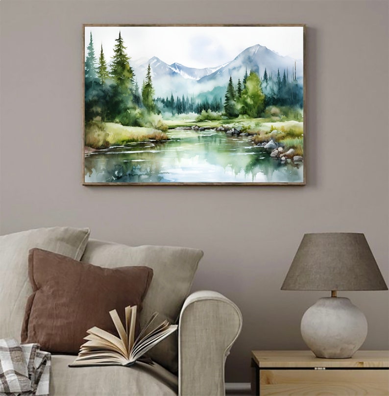 May include: Watercolor painting of a mountain landscape with a river flowing through a forest. The mountains are in the background, and the river is in the foreground. The trees are green and lush, and the water is clear and blue.