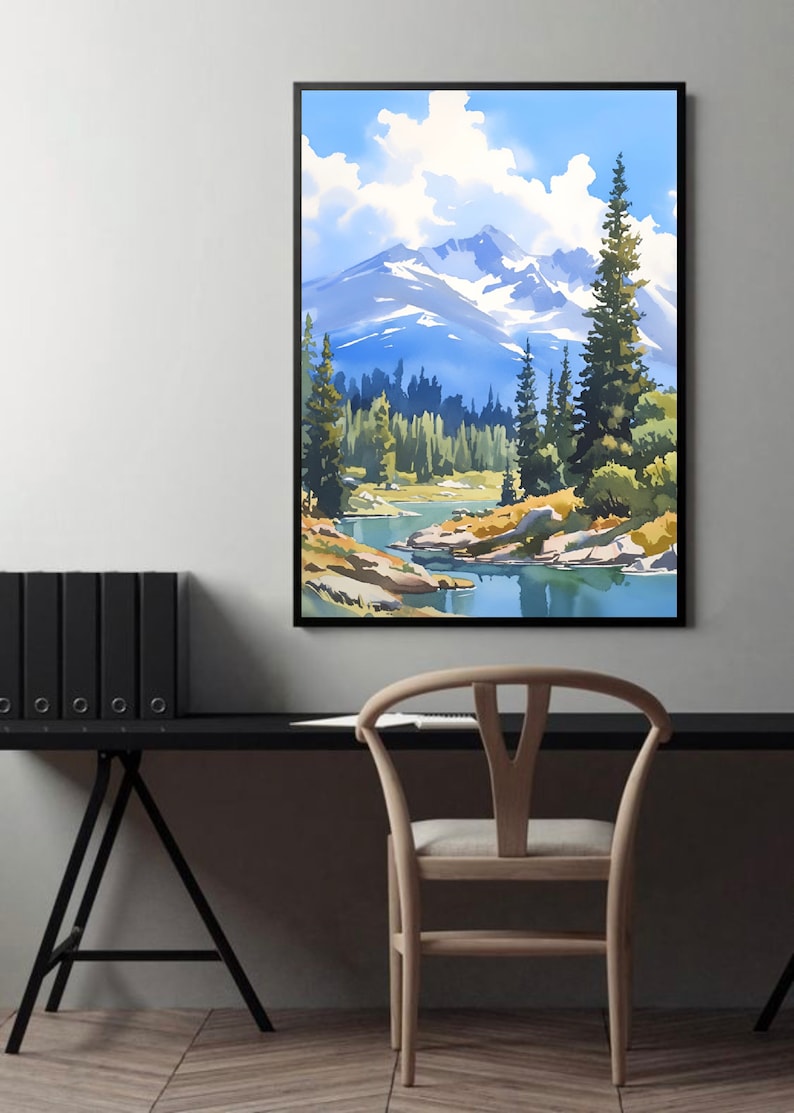 May include: A framed watercolor painting of a mountain landscape with a river flowing through a forest. The sky is blue with white clouds. The mountains are snow-capped and the trees are green.
