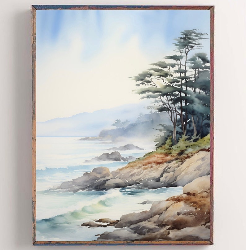 May include: Watercolor painting of a coastal landscape with a rocky shoreline, ocean waves, and a cluster of trees. The artwork features a soft color palette of blues, greens, and browns, framed in a rustic wooden frame.