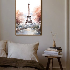 May include: A watercolor painting of the Eiffel Tower in Paris, France. The tower is depicted in the center of the image, with a street scene in the foreground. The painting is framed in a wooden frame.