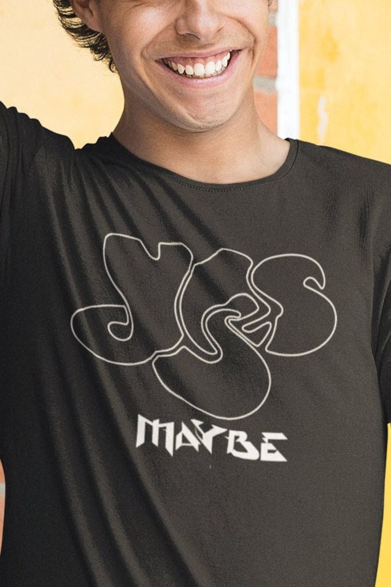May include: A black t-shirt with a white outline of the word "YES" in a stylized font. Below the word "YES" is the word "MAYBE" in a stylized font.