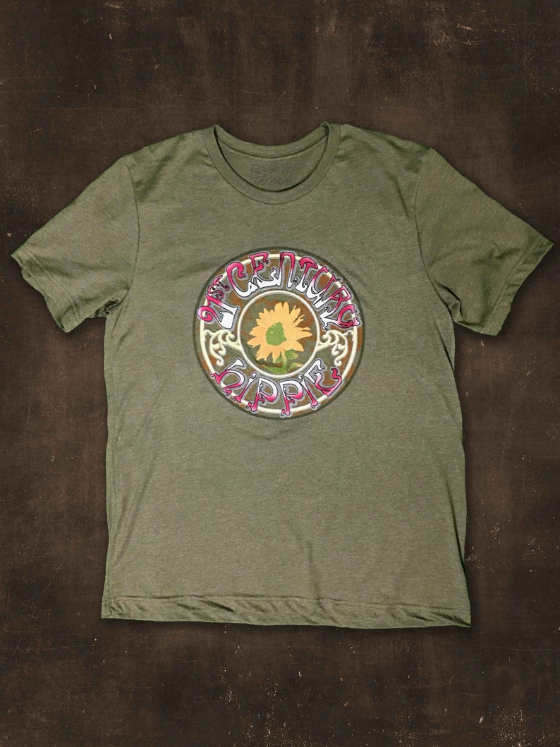 May include: A green t-shirt with a vintage-style graphic of a sunflower and the words "Peace Loving Hippie".