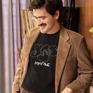 Mid-aged man with good taste in Prog music wearing a Yes-Maybe Tshirt.