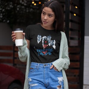 After a getting a coffee this asian girl leaves a coffee shop wearing her Depeche Mode t-shirt.
