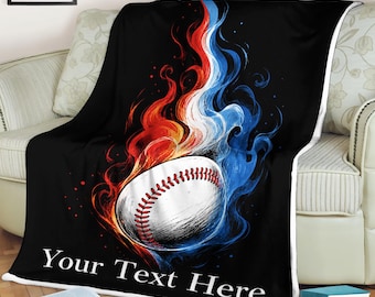 May include: A black fleece blanket featuring a white baseball graphic surrounded by stylized red and blue flames. The design includes the text Your Text Here in white lettering at the bottom, creating a bold contrast against the dark background.