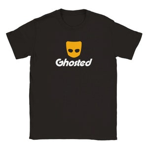 May include: Black t-shirt with a yellow ghost face and the word "Ghosted" in white text.