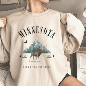 Antigua Minnesota Wild Women's Black Flier Bunker Crew Sweatshirt, Black, 86% Cotton / 11% Polyester / 3% SPANDEX, Size S, Rally House