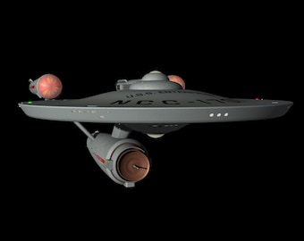 May include: A gray spaceship with a saucer-shaped top and a cylindrical bottom. The spaceship has a red and orange light on the front and the text "U.S.S. ENTERPRISE NCC-1701" on the top.