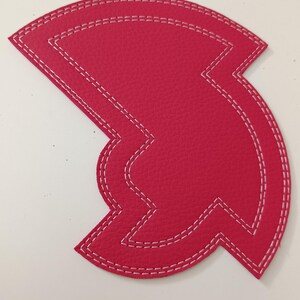 The Chameleon, a imitation leather sewing template for tracing circles and arcs.