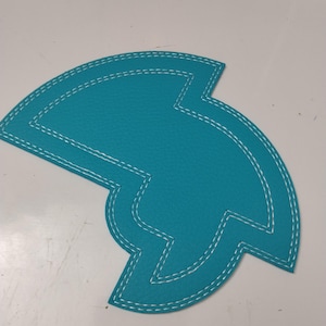 De Chameleon, een naaipatroon van imitatieleer voor het tekenen van cirkels en bogen. (Momenteel niet leverbaar binnen de VS)