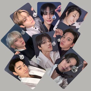 May include: A set of three ceramic mugs with a speckled, matte finish. The mugs are in shades of cream, light brown, and dark brown. Each mug has a simple, minimalist design, perfect for coffee or tea.