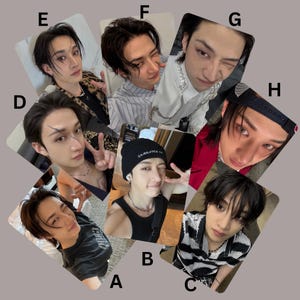 May include: A selection of eight photo cards displaying a young person in diverse poses and attire. The cards present varied facial expressions and clothing styles, including a black beanie, striped shirt, and a red jacket.