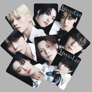 May include: A collection of photo cards featuring portraits of young men. Each card has a black border and the text "Ashes to Light" in white. The men have various hairstyles and expressions, with a neutral background.