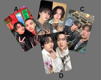 May include: Four photo cards featuring different groups of men. The cards are arranged in a diamond shape. The cards are all black and white and feature the men in different poses. The cards are all the same size and shape.