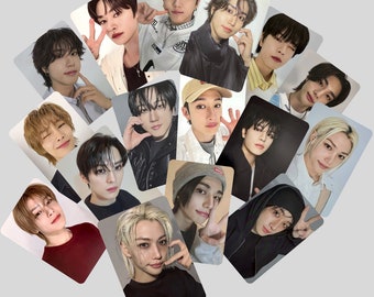 May include: A collection of rectangular photo cards featuring various young men. Each card displays a different individual, with a variety of hairstyles and expressions. The cards are arranged in a circular pattern against a light gray background.