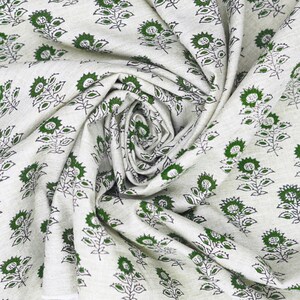 Heavy-weight Indian hand block printed linen blend fabric with green leaf patterns, ideal for cushion covers, curtains, and rustic interior textiles.