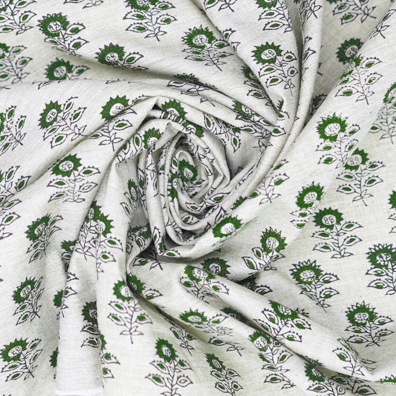 Heavy-weight Indian hand block printed linen blend fabric with green leaf patterns, ideal for cushion covers, curtains, and rustic interior textiles.