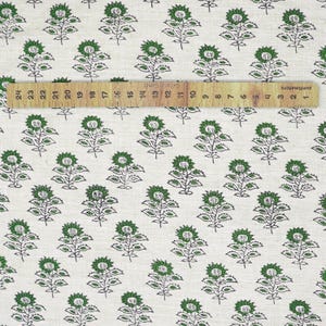 Hand block printed green foliage on beige linen blend, eco-friendly fabric crafted with Indian artisan skill for decorative home accents.