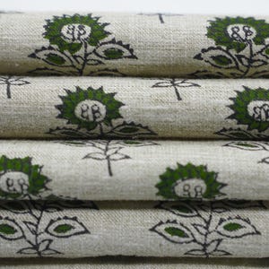 Elegant green block printed linen blend fabric showcasing Indian handmade floral art for use in cushions, napkins, and boho home textiles.