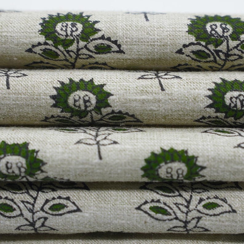 Elegant green block printed linen blend fabric showcasing Indian handmade floral art for use in cushions, napkins, and boho home textiles.