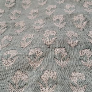 Thick linen fabric with Indian floral pattern for rustic chairs and tablecloths, Indian floral art on thick linen for elegant farmhouse napkins and drapery, Handcrafted thick linen fabric with floral prints for napkin and pillow styling.