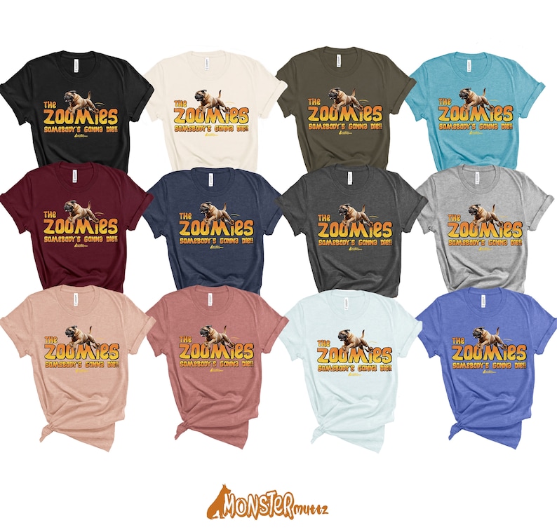 May include: A collection of 10 t-shirts in various colours featuring a graphic of a dog running with the text "The Zoomies, Somebody's Going Die!" printed on the front.