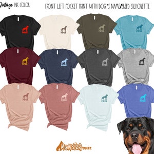 May include: A collection of t-shirts in various colours featuring a silhouette of a dog breed with the name "PIPER" printed on the front left pocket. The shirts are displayed on a white background with a dog breed silhouette in the bottom right corner.
