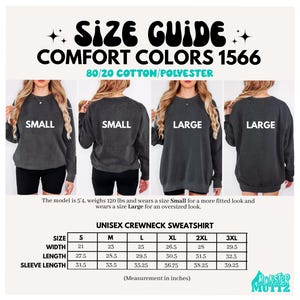 May include: Size guide for Comfort Colors 1566 unisex crewneck sweatshirts. The image shows a size chart with measurements in inches for sizes S to 3XL. The sweatshirts are shown in the image with the sizes Small and Large.