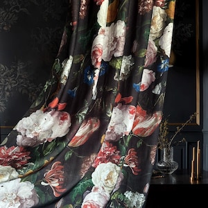 May include: A fabric curtain featuring a dark black background with a dense, colorful floral pattern. The design includes large, blooming flowers in shades of white, cream, soft pink, deep red, and orange, interspersed with green leaves and stems.