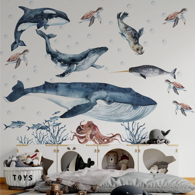 Nursery ocean wall decals and whale stickers featuring watercolor blue whale, octopus, and narwhal