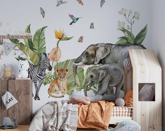 May include: A wall decal set featuring watercolor illustrations of a zebra, a lion cub, and two elephants surrounded by tropical leaves, flowers, hummingbirds, and butterflies. The design includes various jungle animals in natural tones.