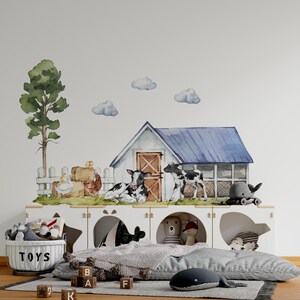 May include: A white farmhouse with a blue roof and a black and white cow in front of it. The farmhouse is surrounded by a white picket fence and green grass. There are also some hay bales and a chicken in the scene. The image is a watercolor painting.
