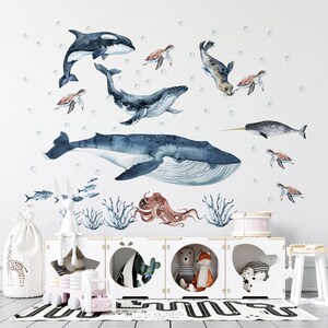 Ocean animal decal and shark wall decal set in nursery; features whale, turtle, and fish wall decal style