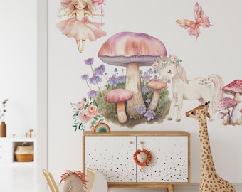 May include: A wall decal set featuring a fairy with pink wings, a unicorn, a large central mushroom, smaller mushrooms, purple flowers, pink roses, and a butterfly. The design includes soft watercolor tones of pink, purple, and cream.