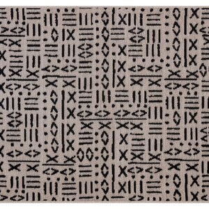 May include: A beige rug with a black geometric pattern. The pattern is made up of lines, squares, and diamonds.