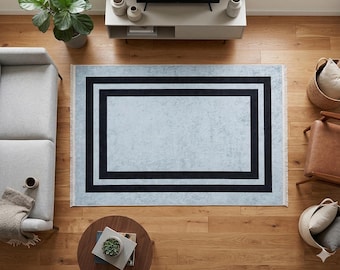 Tapete geométrico moderno cinza, com borda preta, estilo escandinavo para sala de estar.