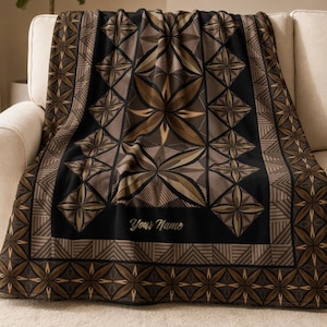 May include: A soft throw blanket featuring a black and brown geometric pattern with repeating star and diamond shapes. The design includes a border of linear motifs and the text Your Name printed in a script font on the lower section.