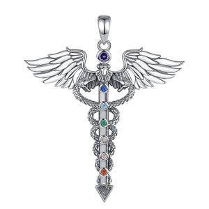 May include: A silver pendant in the shape of a caduceus, with wings and a central staff. The staff is decorated with seven gemstones of different colours. The pendant has a triangular base.