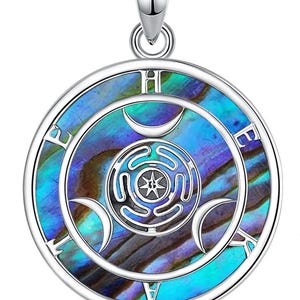 May include: A silver pendant with a circular design. The pendant features a central design with a star, surrounded by a blue, green, and purple iridescent background. The outer ring has the letters "E", "H", and "A".
