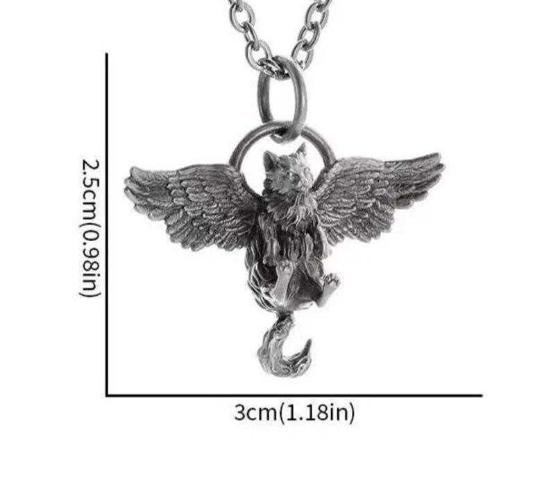 May include: A silver-colored pendant necklace featuring a winged cat design. The pendant measures approximately 1.18 inches wide and 0.98 inches tall. The cat has detailed wings and a curled tail, suspended from a chain.