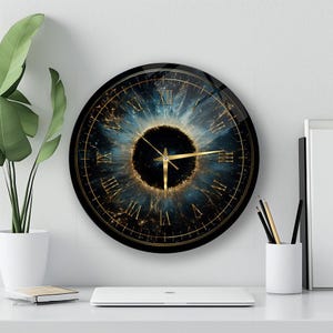 May include: A round wall clock featuring a dark blue and black iris-inspired design with gold Roman numerals and thin gold clock hands. The centre of the clock face is a deep black circle surrounded by radiating blue and gold patterns.