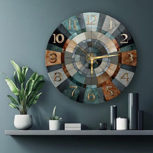 May include: A round wall clock featuring a geometric radial pattern in shades of teal, brown, grey, and cream. The clock face displays large, raised gold-toned numerals from 1 to 12 and thin gold-toned hour, minute, and second hands at the centre.