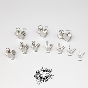 May include: A collection of silver-toned metal stud earrings arranged by size, ranging from 1mm to 10mm. Each pair includes a flat circular front and a rounded back post. A black octopus graphic with the text 70 KNOTS is positioned below the studs.