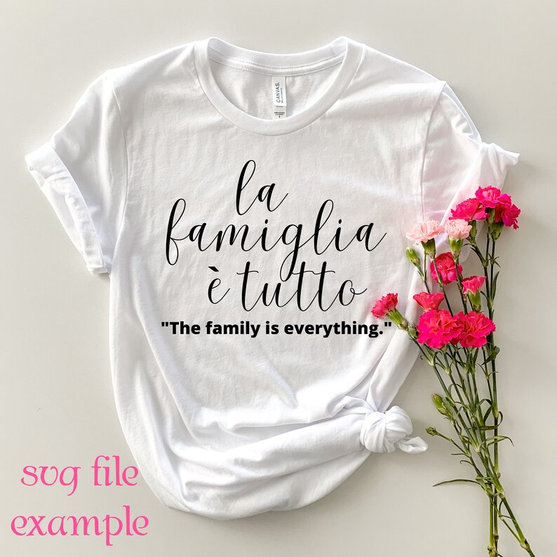 May include: White t-shirt with black text that reads "la famiglia &egrave; tutto" and "The family is everything."