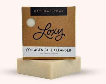 May include: A brown cardboard box with the text "NATURAL SOAP" and "Loxy" in a script font. The box contains a 5 oz. natural soap bar labeled "COLLAGEN FACE CLEANSER".