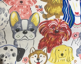 May include: A fabric featuring a colorful, cartoon-style pattern of various dog breeds. The dogs are depicted in a whimsical style, with bright colors and floral accents. The background is a cream color.