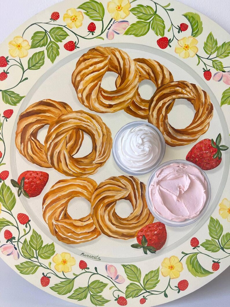 May include: A white plate with a floral border features a variety of pastries, strawberries, and two bowls of whipped cream. The pastries are a light brown color and have a twisted shape. The strawberries are red and have green leaves. The whipped cream is white and fluffy. The plate is decorated with a floral border of green leaves and yellow flowers.