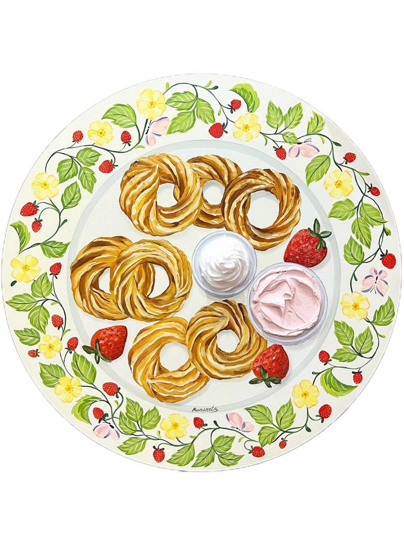 May include: A white ceramic plate with a green vine border featuring yellow flowers and red strawberries. The plate has a variety of pastries, two small bowls of whipped cream, and strawberries.