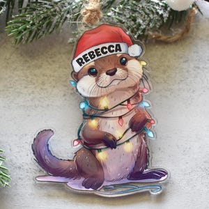 Uroczy ornament w kształcie wydry, spersonalizowany akrylowy prezent świąteczny w kształcie wydry, uroczy prezent dla miłośników przyrody
