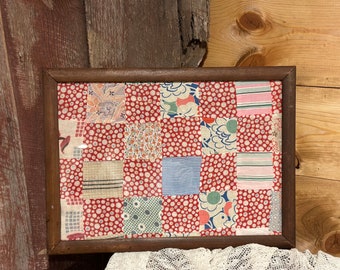 Vintage quilt in wood frame